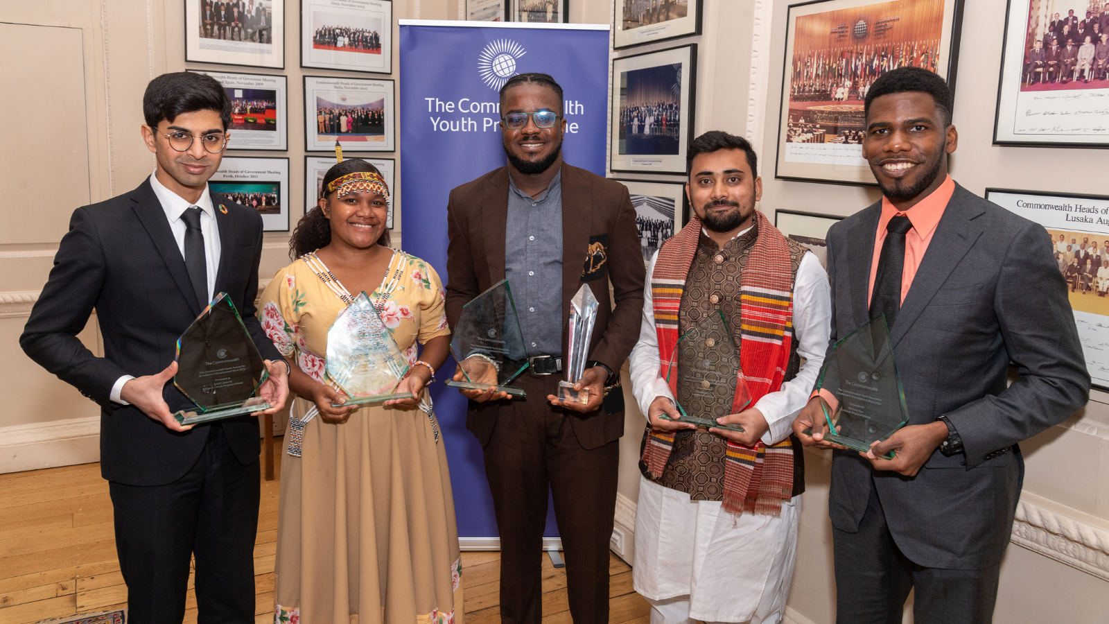 Group photo of 2025 Commonwealth Youth Award winners with their trophies