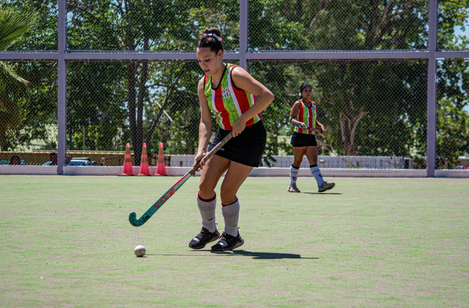 Woman playing Hockey Sport