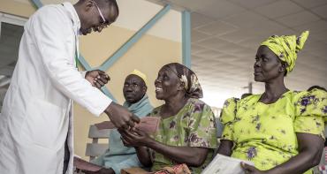 A doctor talking to patients